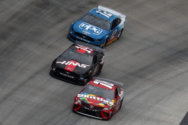 Kyle Busch, Clint Bowyer and Ryan Blaney race at Bristol.