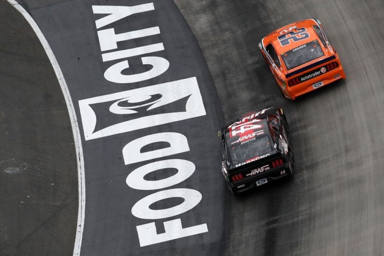 BRISTOL, TN - APRIL 07: Joey Logano, driver of the #22 Autotrader Ford, races Clint Bowyer, driver of the #14 Haas Automation Ford, during the Monster Energy NASCAR Cup Series Food City 500 at Bristol Motor Speedway on April 7, 2019 in Bristol, Tennessee. (Photo by Chris Graythen/Getty Images) | Getty Images