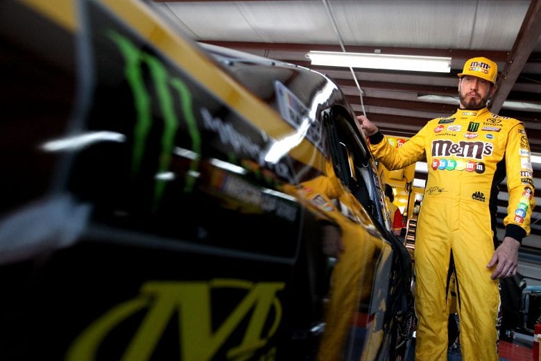 TALLADEGA, AL - APRIL 26: Kyle Busch, driver of the #18 M&M's Chocolate Bar Toyota, stands in the garage during practice for the Monster Energy NASCAR Cup Series GEICO 500 at Talladega Superspeedway on April 26, 2019 in Talladega, Alabama. (Photo by Sean Gardner/Getty Images) | Getty Images