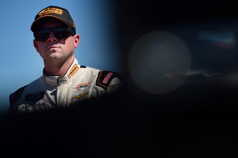 TALLADEGA, AL - APRIL 27: Michael Annett, driver of the #1 TMC Transportation Chevrolet, stands on the grid during qualifying for the NASCAR Xfinity Series MoneyLion 300 at Talladega Superspeedway on April 27, 2019 in Talladega, Alabama. (Photo by Jared C. Tilton/Getty Images) | Getty Images