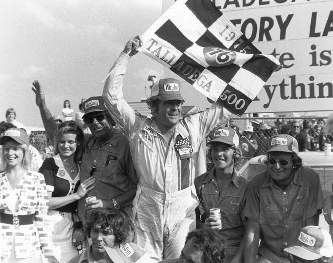 TALLADEGA, AL — August 17, 1975: Buddy Baker in victory lane at Talladega Superspeedway after driving Bud Moore’s Ford to victory in the Talladega 500 NASCAR Cup race. (Photo by ISC Images & Archives via Getty Images)
