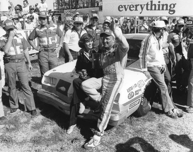 TALLADEGA, AL — May 14, 1978: Cale Yarborough is joined by his wife Betty Jo in victory lane at Talladega Superspeedway after he won the Winston 500 NASCAR Cup race. Driving Junior Johnson’s First National City Traveler’s Checks Chevrolet, Yarborough led 81 of the 188 laps in the event. (Photo by ISC Images & Archives via Getty Images)