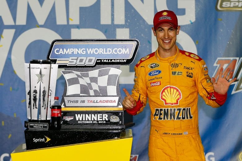 TALLADEGA, AL - OCTOBER 25:  Joey Logano, driver of the #22 Shell Pennzoil Ford, poses in Victory Lane after winning the NASCAR Sprint Cup Series CampingWorld.com 500 at Talladega Superspeedway on October 25, 2015 in Talladega, Alabama.  (Photo by Jonathan Ferrey/NASCAR via Getty Images)