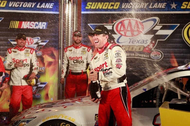 FORT WORTH, TX - NOVEMBER 06: Carl Edwards, driver of the #19 Sport Clips Toyota, celebrates with champagne in Victory Lane after winning the rain-shortened NASCAR Sprint Cup Series AAA Texas 500 at Texas Motor Speedway on November 6, 2016 in Fort Worth, Texas. (Photo by Matt Sullivan/NASCAR via Getty Images)