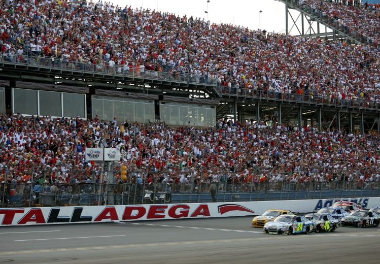 TALLADEGA, AL - OCTOBER 07: Jeff Gordon, driver of the #24 Dupont/Pepsi Chevrolet, crosses the finish line ahead of teammate Jimmie Johnson, driver of the #48 Lowe's Chevrolet, to win the NASCAR Nextel Cup Series UAW-Ford 500 at Talladega Superspeedway on October 7, 2007 in Talladega, Alabama. (Photo by Marc Serota/Getty Images for NASCAR) | Getty Images
