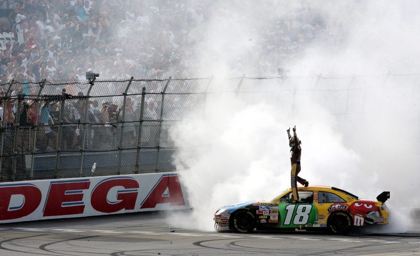 TALLADEGA, AL - APRIL 27:  Kyle Busch, driver of the #18 M&M's Toyota, celebrates after winning the NASCAR Sprint Cup Series Aaron's 499 at Talladega Superspeedway on April 27, 2008 in Talladega, Alabama.  (Photo by Jason Smith/Getty Images for NASCAR) | Getty Images