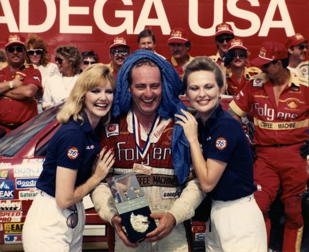 TALLADEGA, AL - JULY 31: Ken Schrader, driver of the #25 Folgers Chevrolet and guest celebrate in Victory Lane after winning the Winston Cup Series Talladega DieHard 500 at Talladega Superspeedway on July 31, 1988 in Talladega, Alabama.