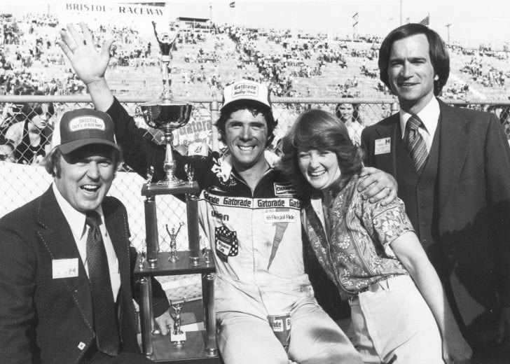 BRISTOL, TN - APRIL 2, 1978:  Darrell Waltrip wasn't always the easiest on his crew members, but heaped mounds of praise on them after winning the Southeastern 500 at Bristol in 1978. Pictured are Waltrip (C), Bristol president & GM Lanny Hester (L), Darrell's wife Stevie, and track VP Gary Baker.  (Photo by ISC Archives via Getty Images)