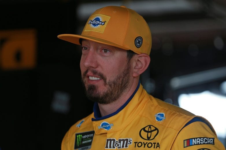 DOVER, DE - MAY 04: Kyle Busch, driver of the #18 Pedigree Toyota, stands in the garage during practice for the Monster Energy NASCAR Cup Series Gander RV 400 at Dover International Speedway on May 4, 2019 in Dover, Delaware. (Photo by Matt Sullivan/Getty Images) | Getty Images