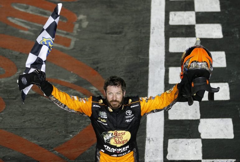 CHARLOTTE, NORTH CAROLINA - MAY 26: Martin Truex Jr., driver of the #19 Bass Pro Shops/TRACKER/USO Toyota, celebrates after winning the Monster Energy NASCAR Cup Series Coca-Cola 600 at Charlotte Motor Speedway on May 26, 2019 in Charlotte, North Carolina. (Photo by Brian Lawdermilk/Getty Images) | Getty Images