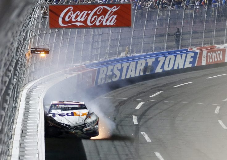 CHARLOTTE, NORTH CAROLINA - MAY 26: Denny Hamlin, driver of the #11 FedEx Ground Toyota, crashes during the Monster Energy NASCAR Cup Series Coca-Cola 600 at Charlotte Motor Speedway on May 26, 2019 in Charlotte, North Carolina. (Photo by Brian Lawdermilk/Getty Images) | Getty Images