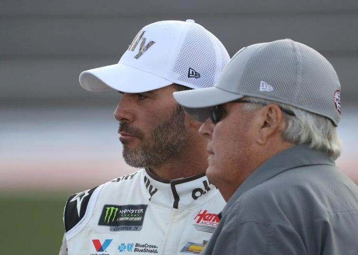 CHARLOTTE, NORTH CAROLINA - MAY 23: (L-R) Jimmie Johnson, driver of the #48 Ally Patriotic Chevrolet, and NASCAR Hall of Famer and team owner Rick Hendrick talk during qualifying for the Monster Energy NASCAR Cup Series Race Coca-Cola 600 at Charlotte Motor Speedway on May 23, 2019 in Charlotte, North Carolina. (Photo by Streeter Lecka/Getty Images) | Getty Images