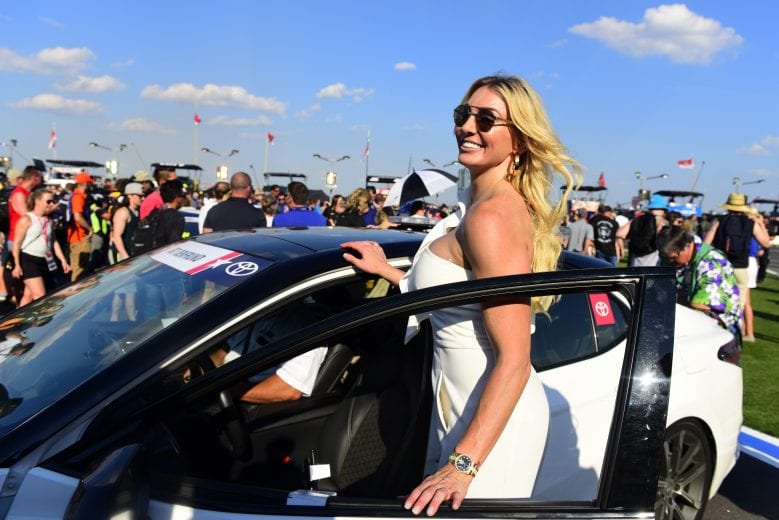 CHARLOTTE, NORTH CAROLINA - MAY 26: American professional wrestler Charlotte Flair prepares to climb into the pace car to lead the field to the start of the Monster Energy NASCAR Cup Series Coca-Cola 600 at Charlotte Motor Speedway on May 26, 2019 in Charlotte, North Carolina. (Photo by Jared C. Tilton/Getty Images) | Getty Images