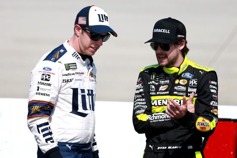 DOVER, DE - MAY 03: Brad Keselowski, driver of the #2 Miller Lite Ford, and Ryan Blaney, driver of the #12 Menards/Duracell Ford, stand on pit road during qualifying for the Monster Energy NASCAR Cup Series Gander RV 400 at Dover International Speedway on May 3, 2019 in Dover, Delaware. (Photo by Sean Gardner/Getty Images) | Getty Images