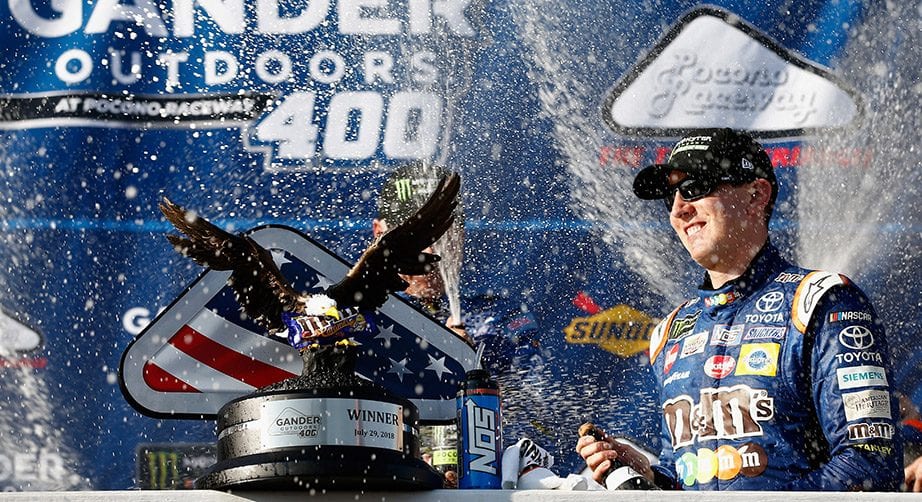 Kyle Busch celebrates winning at Pocono in 2018.