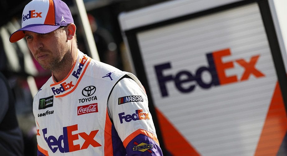 Denny Hamlin looks on on pit road.