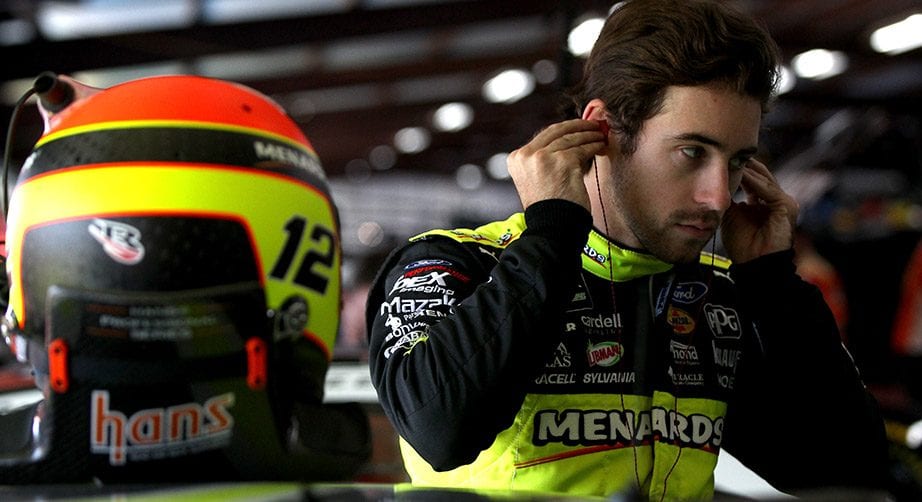 Ryan Blaney looks on in the garage.