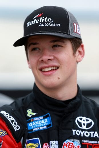 DOVER, DE - MAY 03: Harrison Burton, driver of the #18 Safelite AutoGlass Toyota, stands on pit road during qualifying for the NASCAR Gander Outdoors Truck Series JEGS 200 at Dover International Speedway on May 3, 2019 in Dover, Delaware. (Photo by Sean Gardner/Getty Images) | Getty Images