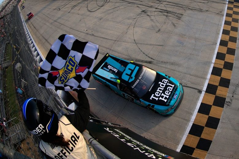 DOVER, DE - MAY 03: Johnny Sauter, driver of the #13 Tenda Heal Ford, takes the checkered flag to win the NASCAR Gander Outdoors Truck Series JEGS 200 at Dover International Speedway on May 3, 2019 in Dover, Delaware. (Photo by Chris Trotman/Getty Images) | Getty Images