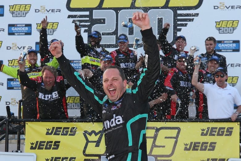 DOVER, DE - MAY 03: Johnny Sauter, driver of the #13 Tenda Heal Ford, celebrates in Victory Lane after winning the NASCAR Gander Outdoors Truck Series JEGS 200 at Dover International Speedway on May 3, 2019 in Dover, Delaware. (Photo by Matt Sullivan/Getty Images) | Getty Images