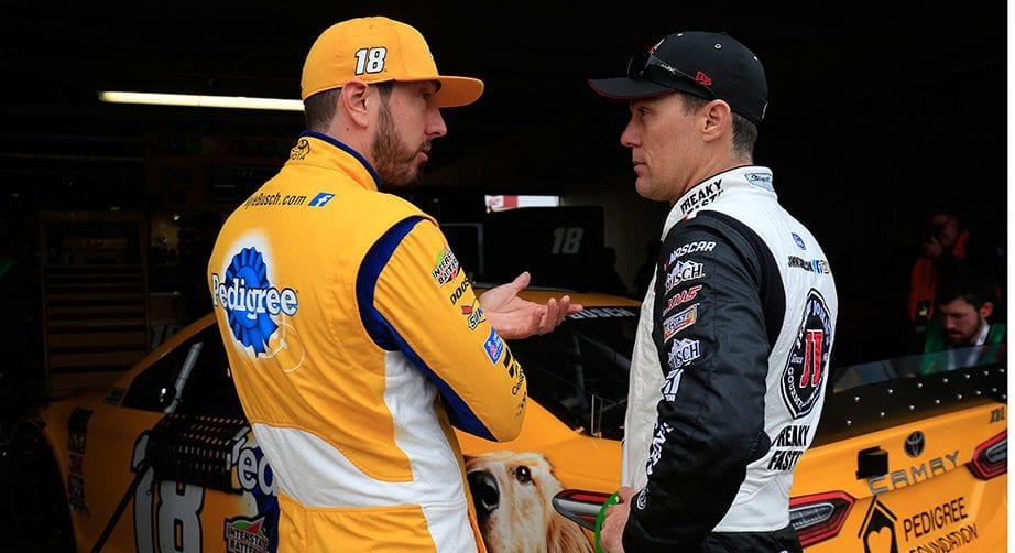 DOVER, DE - MAY 04:  Kyle Busch, driver of the #18 Pedigree Toyota, talks with Kevin Harvick, driver of the #4 Jimmy John's Ford, during practice for the Monster Energy NASCAR Cup Series Gander RV 400 at Dover International Speedway on May 4, 2019 in Dover, Delaware.  (Photo by Chris Trotman/Getty Images) | Getty Images
