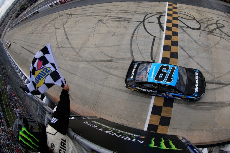 Martin Truex Jr. takes the checkered flag at Dover.