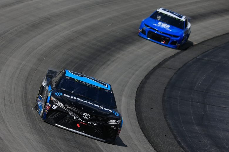 Martin Truex Jr. leads Alex Bowman at Dover.