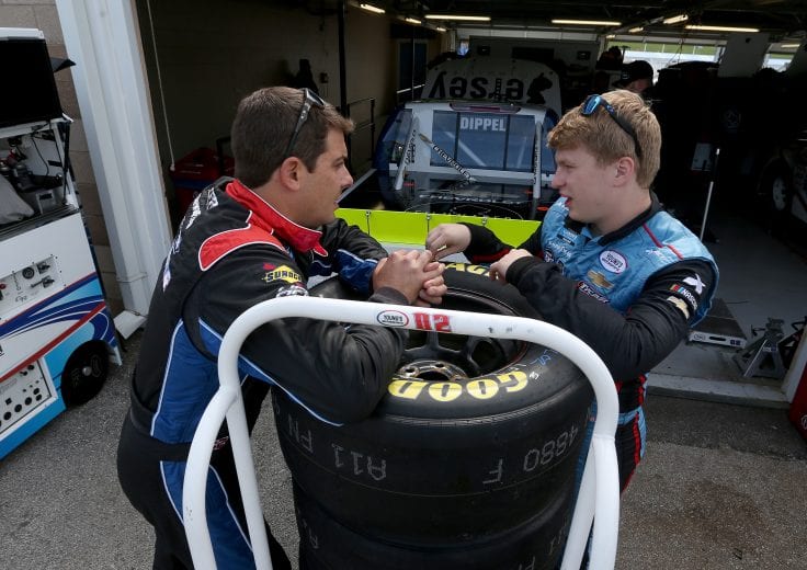 KANSAS CITY, KS - MAY 10:  Stewart Friesen, driver of the #52 Halmar International Chevrolet, and Tyler Dippel, driver of the #02 Jersey Filmmaker Chevrolet, stand in the garage during practice for the NASCAR Gander Outdoors Truck Series Digital Ally 250 at Kansas Speedway on May 10, 2019 in Kansas City, Kansas.  (Photo by Brian Lawdermilk/Getty Images) | Getty Images