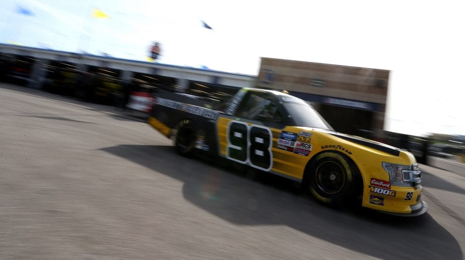 KANSAS CITY, KS - MAY 10:  Grant Enfinger, driver of the #98 Protect The Harvest/Curb Records Ford, drives through the garage during practice for the NASCAR Gander Outdoors Truck Series Digital Ally 250 at Kansas Speedway on May 10, 2019 in Kansas City, Kansas.  (Photo by Brian Lawdermilk/Getty Images) | Getty Images