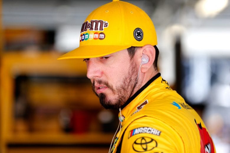 KANSAS CITY, KS - MAY 10: Kyle Busch, driver of the #18 M&M's Red Nose Day Toyota, stands in the garage during practice for the Monster Energy NASCAR Cup Series Digital Ally 400 at Kansas Speedway on May 10, 2019 in Kansas City, Kansas. (Photo by Brian Lawdermilk/Getty Images) | Getty Images