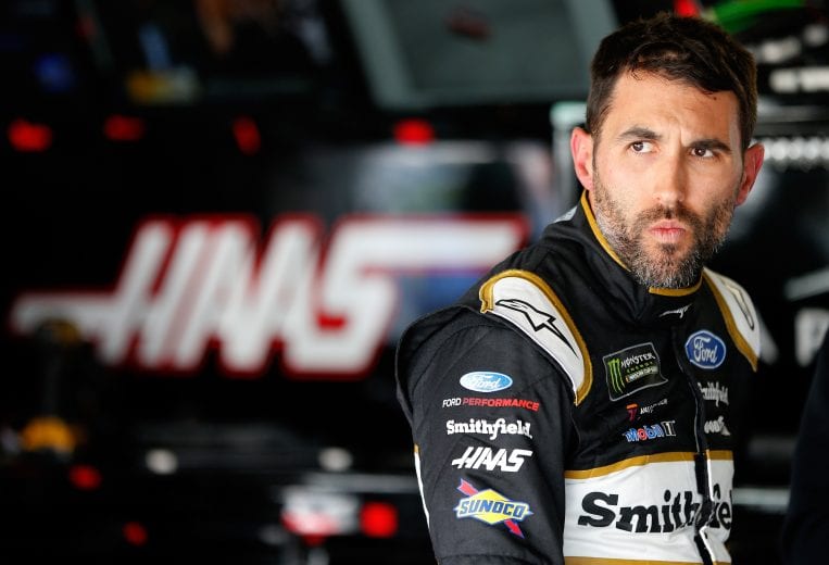 KANSAS CITY, KS - MAY 10:  Aric Almirola, driver of the #10 Smithfield Ford, stands in the garge during practice for the Monster Energy NASCAR Cup Series Digital Ally 400 at Kansas Speedway on May 10, 2019 in Kansas City, Kansas.  (Photo by Brian Lawdermilk/Getty Images) | Getty Images