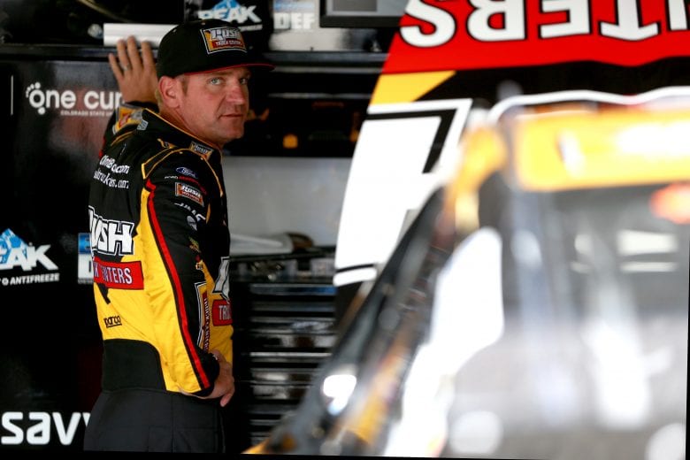 KANSAS CITY, KS - MAY 10:  Clint Bowyer, driver of the #14 Rush Truck Centers/Haas Automation Ford, stands in the garage during practice for the Monster Energy NASCAR Cup Series Digital Ally 400 at Kansas Speedway on May 10, 2019 in Kansas City, Kansas.  (Photo by Sean Gardner/Getty Images) | Getty Images