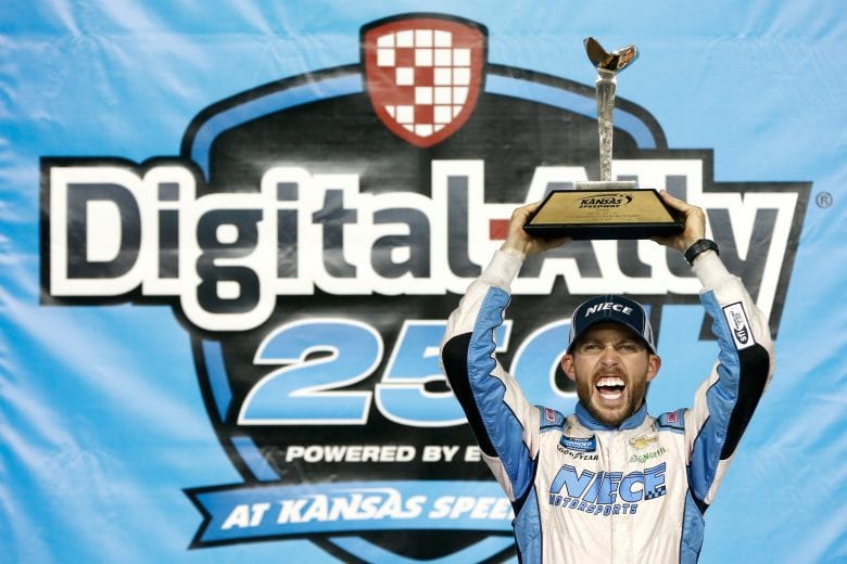 KANSAS CITY, KS - MAY 10:  Ross Chastain, driver of the #45 TruNorth/Paul Jr. Designs Chevrolet, celebrates in victory lane after winning the NASCAR Gander Outdoors Truck Series Digital Ally 250 at Kansas Speedway on May 10, 2019 in Kansas City, Kansas.  (Photo by Brian Lawdermilk/Getty Images) | Getty Images