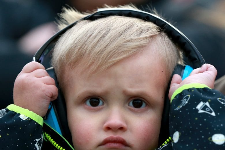 KANSAS CITY, KS - MAY 11:  A young race fan looks on during the Monster Energy NASCAR Cup Series Digital Ally 400 at Kansas Speedway on May 11, 2019 in Kansas City, Kansas.  (Photo by Sean Gardner/Getty Images) | Getty Images