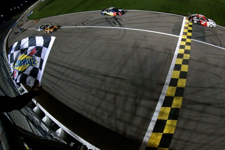 KANSAS CITY, KS - MAY 11:  Brad Keselowski, driver of the #2 Wurth Ford, takes the checkered flag to win the Monster Energy NASCAR Cup Series Digital Ally 400 at Kansas Speedway on May 11, 2019 in Kansas City, Kansas.  (Photo by Sean Gardner/Getty Images) | Getty Images