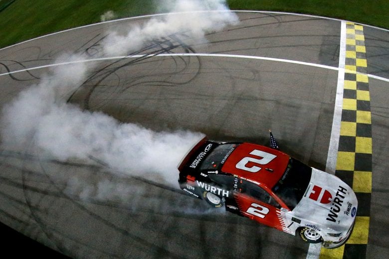 KANSAS CITY, KS - MAY 11:  Brad Keselowski, driver of the #2 Wurth Ford, does a burn out after winning the Monster Energy NASCAR Cup Series Digital Ally 400 at Kansas Speedway on May 11, 2019 in Kansas City, Kansas.  (Photo by Sean Gardner/Getty Images) | Getty Images