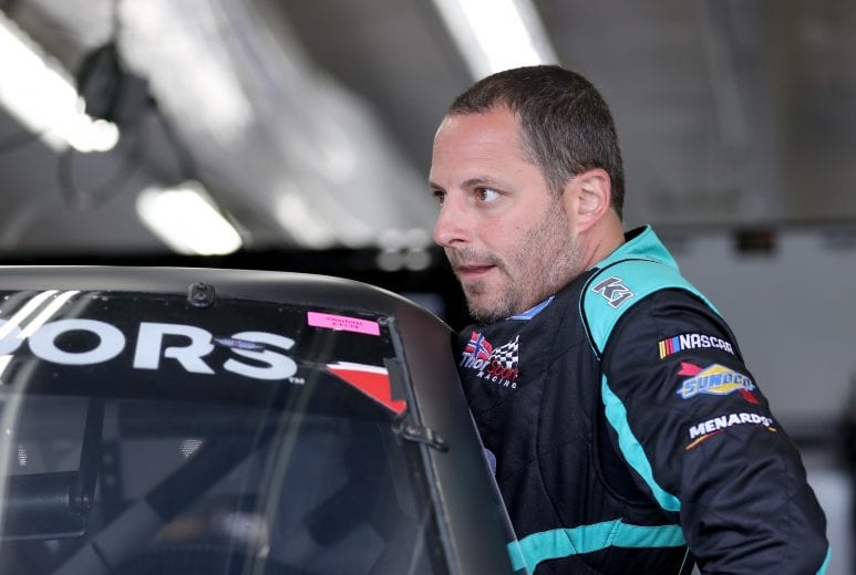 CHARLOTTE, NC - MAY 17:  Johnny Sauter, driver of the #13 Tenda Heal Ford, gets into his truck during practice for the NASCAR Gander Outdoors Truck Series North Carolina Education Lottery 200 at Charlotte Motor Speedway on May 17, 2019 in Charlotte, North Carolina.  (Photo by Streeter Lecka/Getty Images) | Getty Images
