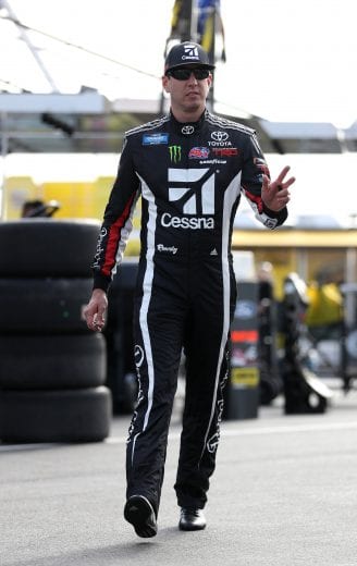 CHARLOTTE, NC - MAY 17:  Kyle Busch, driver of the #51 Cessna Toyota, walks through the garage area during practice for the NASCAR Gander Outdoors Truck Series North Carolina Education Lottery 200 at Charlotte Motor Speedway on May 17, 2019 in Charlotte, North Carolina.  (Photo by Streeter Lecka/Getty Images) | Getty Images