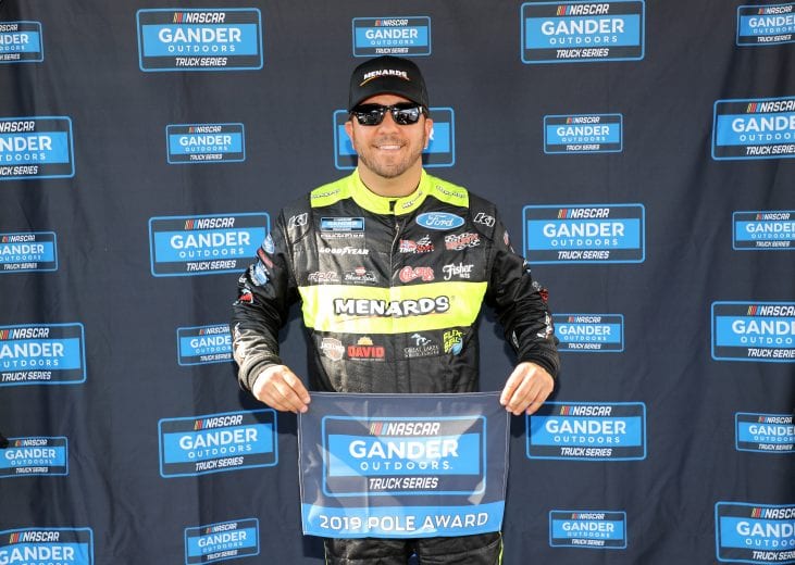 CHARLOTTE, NC - MAY 17:  Matt Crafton, driver of the #88 Ideal Door/Menards Ford, poses with the pole award after qualifying for the NASCAR Gander Outdoors Truck Series North Carolina Education Lottery 200 at Charlotte Motor Speedway on May 17, 2019 in Charlotte, North Carolina.  (Photo by Streeter Lecka/Getty Images) | Getty Images