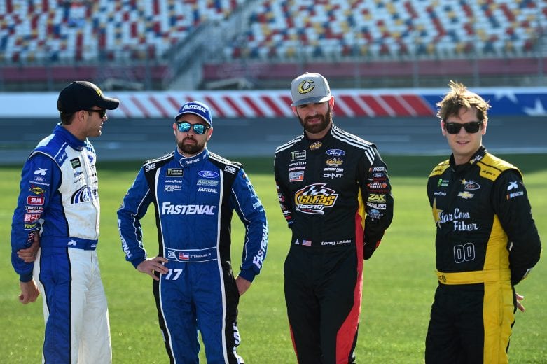 CHARLOTTE, NC - MAY 17:  (L-R) David Ragan, driver of the #38 MDS Transport Ford, Ricky Stenhouse Jr., driver of the #17 Fastenal Ford, Corey LaJoie, driver of the #32 Freedom Hard Ford, and Landon Cassill, driver of the #00 Elongator Tailgates Chevrolet, look on during qualifying for the Monster Energy NASCAR Cup Series Open Race at Charlotte Motor Speedway on May 17, 2019 in Charlotte, North Carolina.  (Photo by Jared C. Tilton/Getty Images) | Getty Images