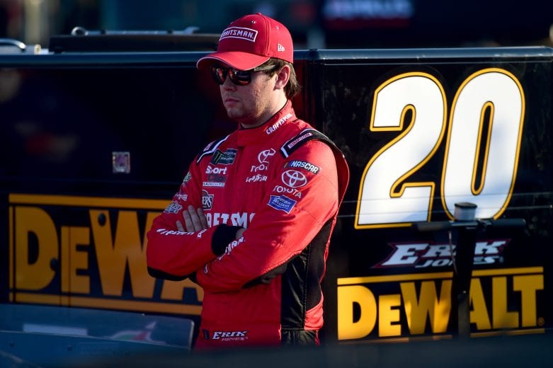 CHARLOTTE, NC - MAY 17:  Erik Jones, driver of the #20 Craftsman Toyota, stands in the garage area during qualifying for the Monster Energy NASCAR Cup Series All-Star Race at Charlotte Motor Speedway on May 17, 2019 in Charlotte, North Carolina.  (Photo by Jared C. Tilton/Getty Images) | Getty Images