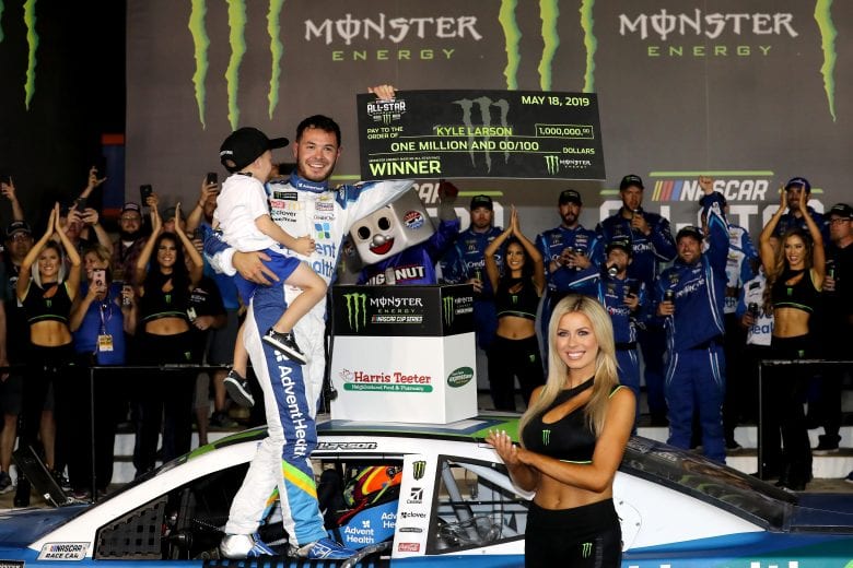 CHARLOTTE, NORTH CAROLINA - MAY 18: Kyle Larson, driver of the #42 Advent Health Chevrolet, celebrates with his son Owen in Victory Lane after winning the Monster Energy NASCAR Cup Series All-Star Race at Charlotte Motor Speedway on May 18, 2019 in Charlotte, North Carolina. (Photo by Streeter Lecka/Getty Images) | Getty Images
