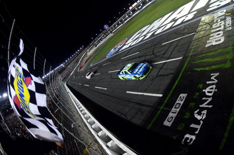 CHARLOTTE, NORTH CAROLINA - MAY 18: Kyle Larson, driver of the #42 Advent Health Chevrolet, takes the checkered flag to win the Monster Energy NASCAR Cup Series All-Star Race at Charlotte Motor Speedway on May 18, 2019 in Charlotte, North Carolina. (Photo by Jared C. Tilton/Getty Images) | Getty Images