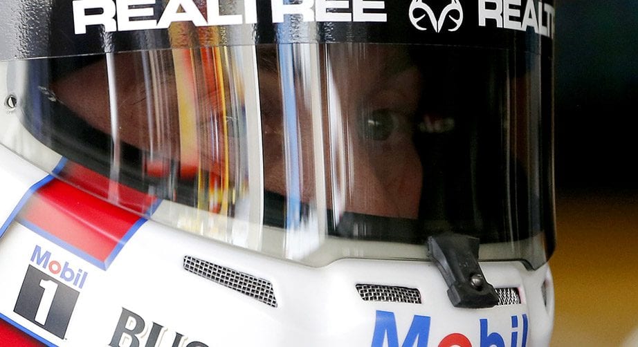 Kevin Harvick looks on in the garage at Charlotte.