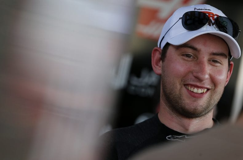 CHARLOTTE, NORTH CAROLINA - MAY 23: Chase Briscoe, driver of the #98 Nutri Chomps/Pet Supermarket Ford, stands in the garage area during practice for the NASCAR Xfinity Series Alsco 300 at Charlotte Motor Speedway on May 23, 2019 in Charlotte, North Carolina. (Photo by Brian Lawdermilk/Getty Images) | Getty Images