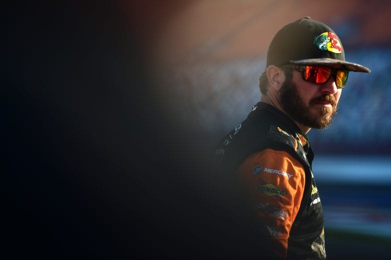 CHARLOTTE, NORTH CAROLINA - MAY 23: Martin Truex Jr., driver of the #19 Bass Pro Shops/TRACKER/USO Toyota, stands on the grid during qualifying for the Monster Energy NASCAR Cup Series Open Race Coca-Cola 600 at Charlotte Motor Speedway on May 23, 2019 in Charlotte, North Carolina. (Photo by Jared C. Tilton/Getty Images) | Getty Images