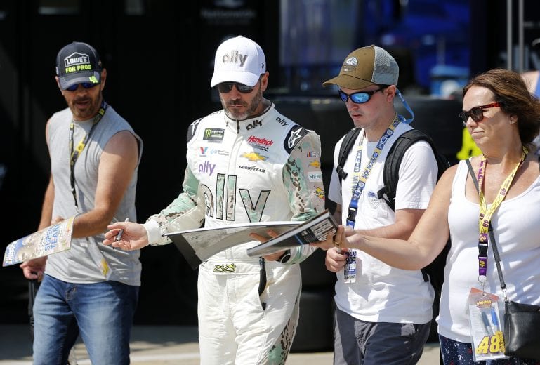CHARLOTTE, NORTH CAROLINA - MAY 25: Jimmie Johnson, driver of the #48 Ally Patriotic Chevrolet, signs autographs before practice for the Monster Energy NASCAR Cup Series Coca-Cola 600 at Charlotte Motor Speedway on May 25, 2019 in Charlotte, North Carolina. (Photo by Brian Lawdermilk/Getty Images) | Getty Images