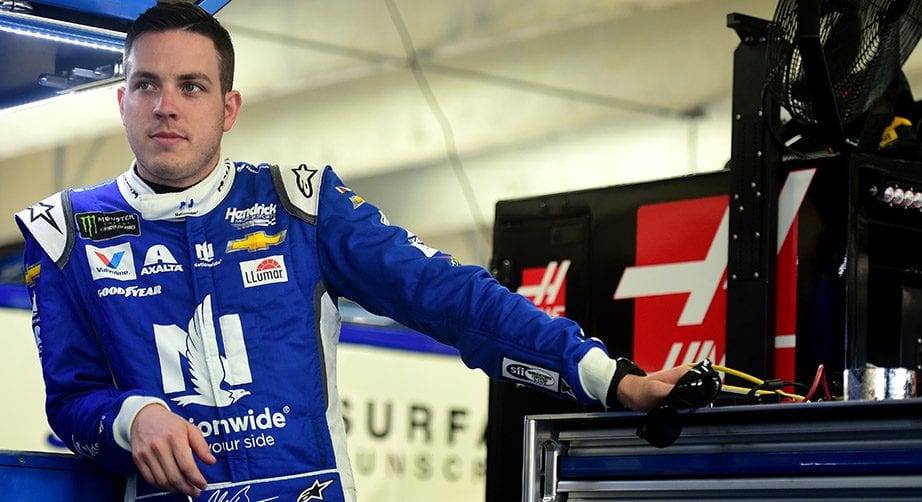 Alex Bowman looks on in the garage area at Charlotte.