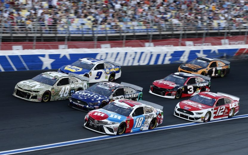 CHARLOTTE, NORTH CAROLINA - MAY 26: Kyle Busch, driver of the #18 M&M's Red White & Blue Toyota, leads a pack of cars during the Monster Energy NASCAR Cup Series Coca-Cola 600 at Charlotte Motor Speedway on May 26, 2019 in Charlotte, North Carolina. (Photo by Brian Lawdermilk/Getty Images) | Getty Images