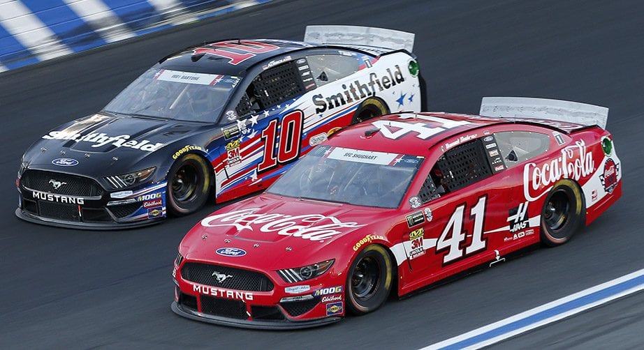 Daniel Suarez and Aric Almirola race off the corner during the 2019 Coca-Cola 600 at Charlotte.